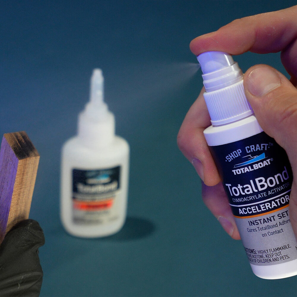 TotalBoat TotalBond CA Glue Accelerator being sprayed on board with glue