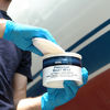 TotalBoat Premium Marine Paste Wax being applied to a boat